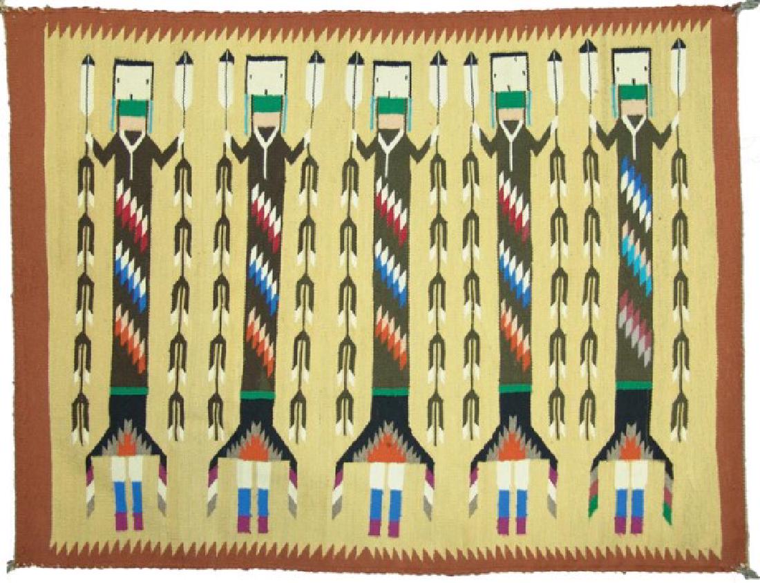 Navajo Rug/Weaving: Colorful, fine weave Yei figured rug the five deities all with corn stock and feather staffs, the bodies with unique rows if serrated elements. Very good condition. Minor edge erosion.,,40" x 33"