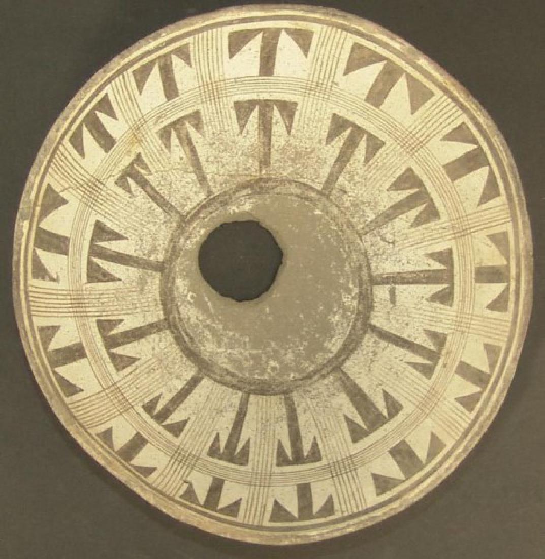 Mimbres Pottery Bowl: Exquisite larger, killed, black-on-white bowl the very wide design band a fine line grid forming two zones of "T" shaped units that repeat throughout the entire design. Good condition, intact, glued b