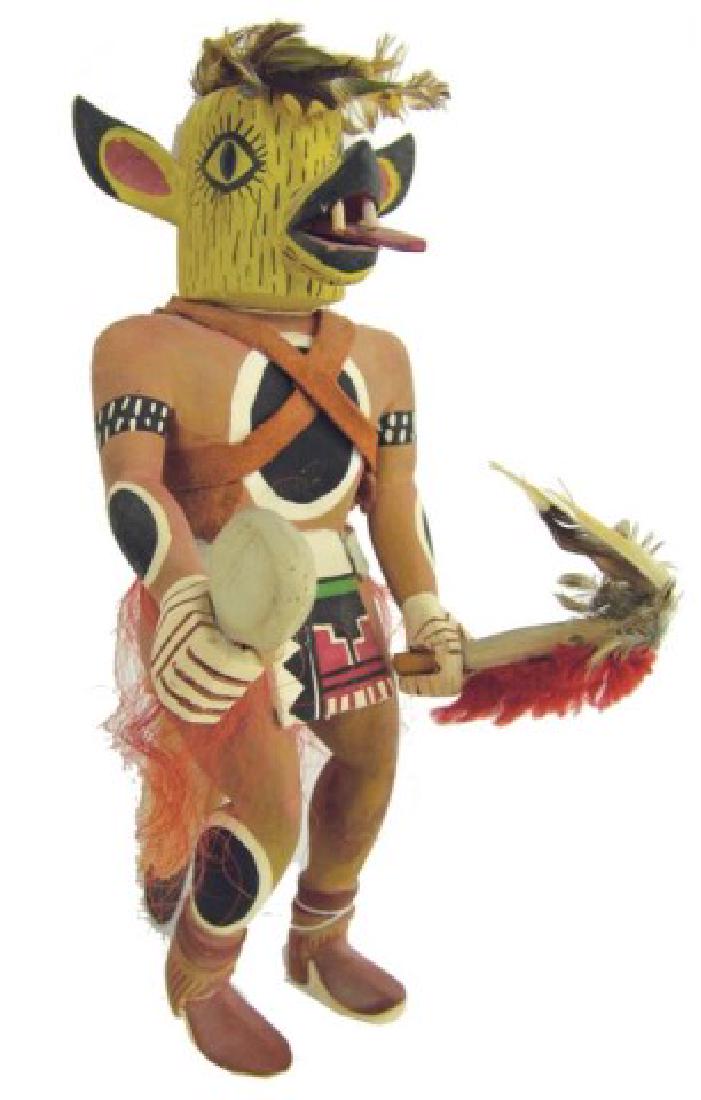 Hopi Kachina Carving: Rare, hand carved and painted cotton wood root Coyote kachina doll shown with dance wand, and rattle, and with it's tongue hanging out of it's mouth. Good condition, minor scuffs.,,12"