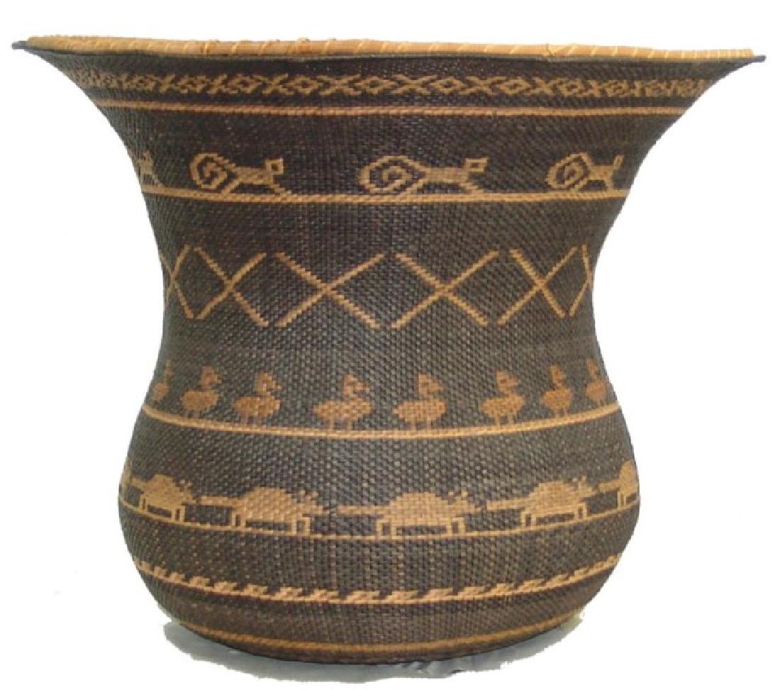 Ye' Kuana Basket: Wonderful, fine weave, twined olla with flared rim done in reverse design and loaded with squirrels, ducks, armadillos, and crosses. Excellent condition. From Venezuela/Amazon.,,14" x 17"