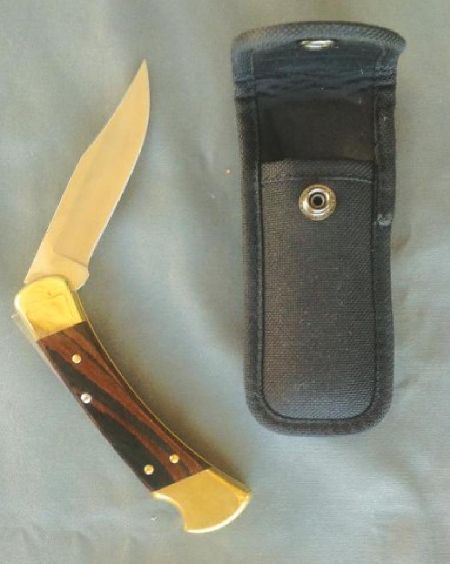 Buck Knife and Sheath: Fine "Buck 110" folding knife with wood handle and modern case. Very good condition- no wobble, very sharp!,,Overall 8 1/2"L x Blade 3 3/4"