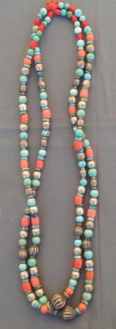 Tibetan Bead Necklace: Colorful, two strand necklace made with turquoise, coral, and hand wrought fancy German silver beads, from Nepal. Very good condition.,,26"
