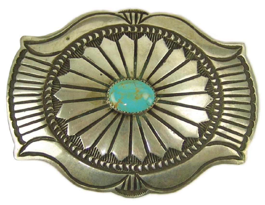 Navajo Buckle - A.E.: Beautiful handwrought all silver belt buckle with radiating feather design and fine stamped details. Very good condition. Hallmarked "AE."3-1/4" x 4"Ca. 1980s