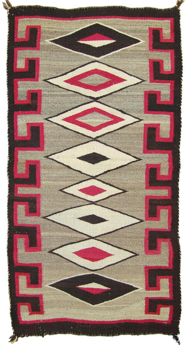 Navajo Rug/Weaving: Classic, small runner shaped rug with Red Mesa type diamond design done on homespun wool. Very good condition, shows some use.24" x 47"Ca. 1940s