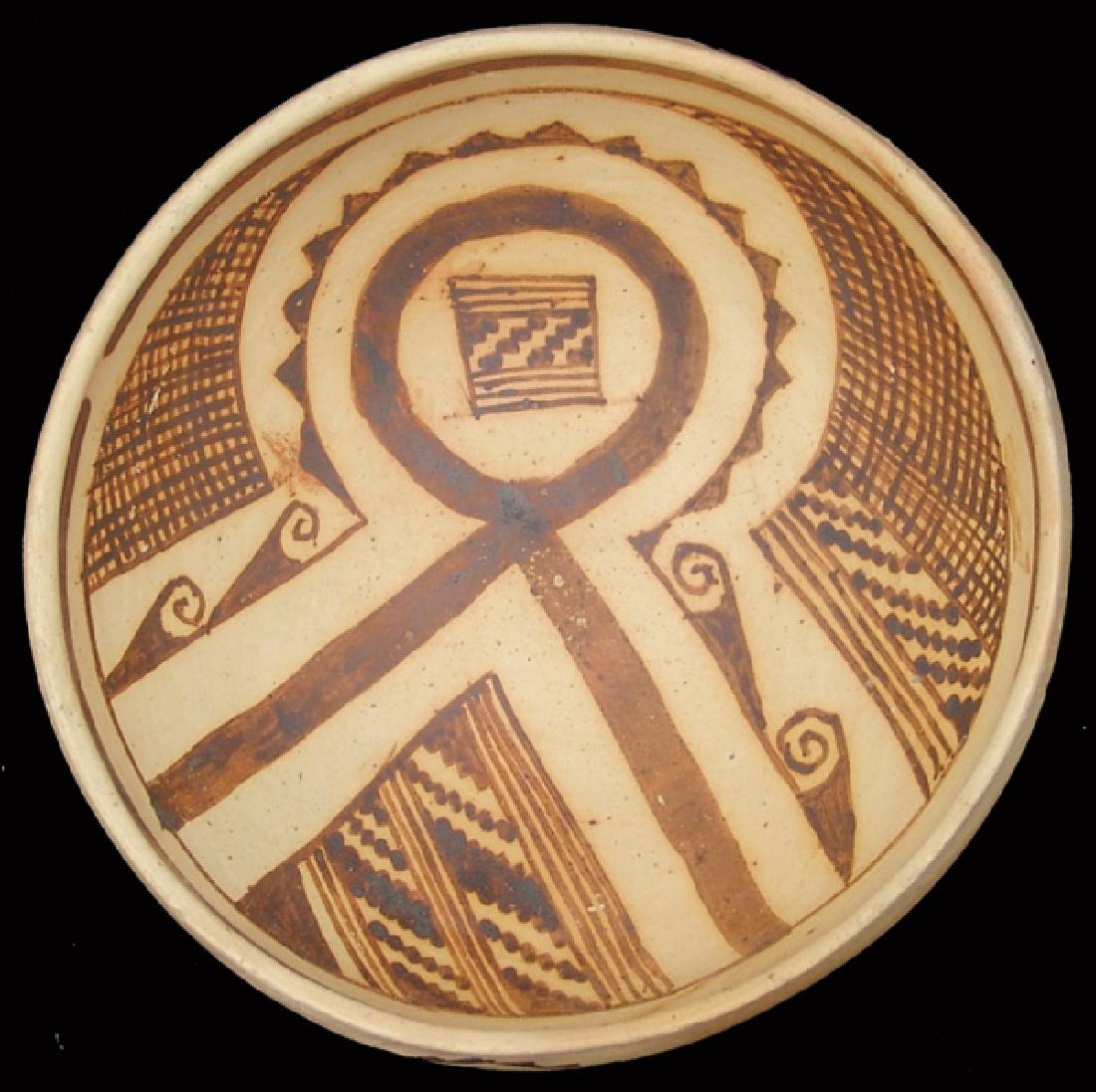 Anasazi Pottery Bowl: Beautiful, black-on-yellow bowl with linked arrows on exterior having diamond boxes in their middles, plus an interesting, somewhat symmetrical design on the interior, marked "Walpi." Very good condit