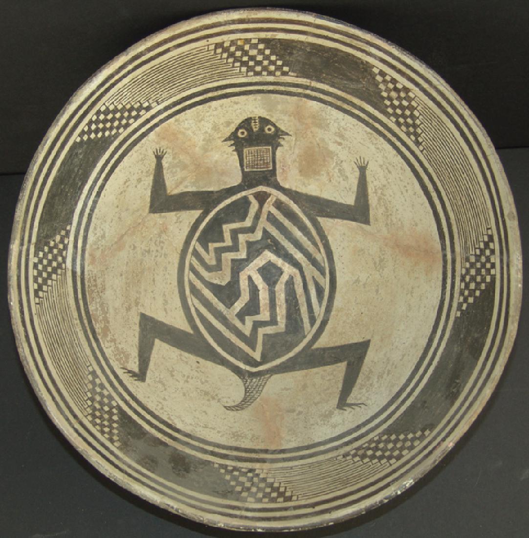 Mimbres Pottery Bowl: Large, flared, black-on-white bowl with design band containing hachure and stepped checks flanked by double wide line bands, all surrounding a stylized horned toad in the center. Very good condition, 
