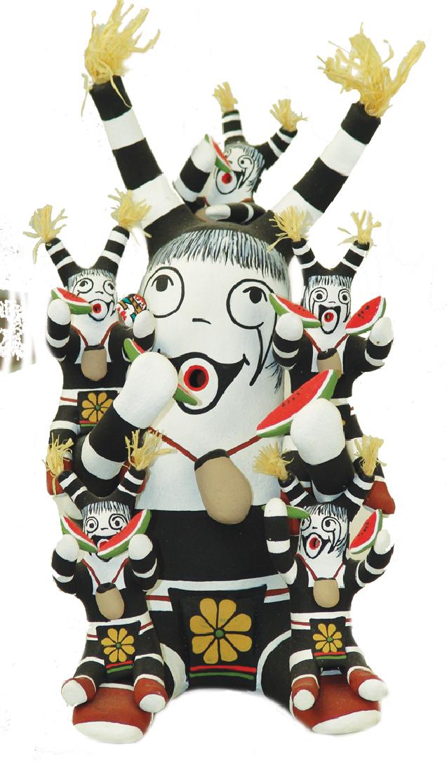 Hopi Pottery Figure - Tony Dallas: Larger, hand crafted "storyteller" figure a black and white Koshare clown with five children/babies, all eating watermelon slices. Very good condition.5" x 8" x 4"Early 2000s