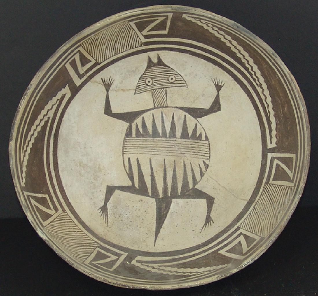 Mimbres Pottery Bowl: Large, black-on-white bowl with negative, three-way design band with hachured boxes and scalloped banners, plus a large horned toad figure with fine line head, neck, body band, and serrated sections. 