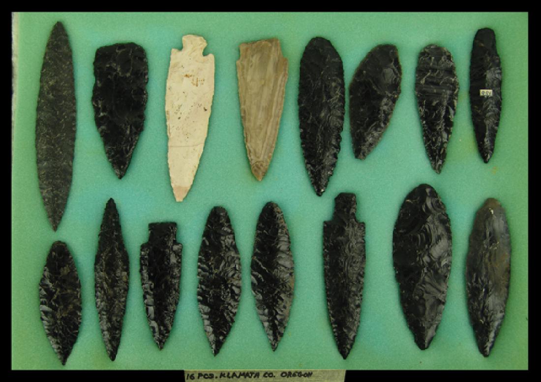 Large Oregon Points and Blades: Impressive display of 16 larger obsidian and stone points and blade marked "16 pcs Klamath collection Oregon" Most in very good condition. In 17" x 12" ryker mount.Largest 6-1/4"Pre Historic