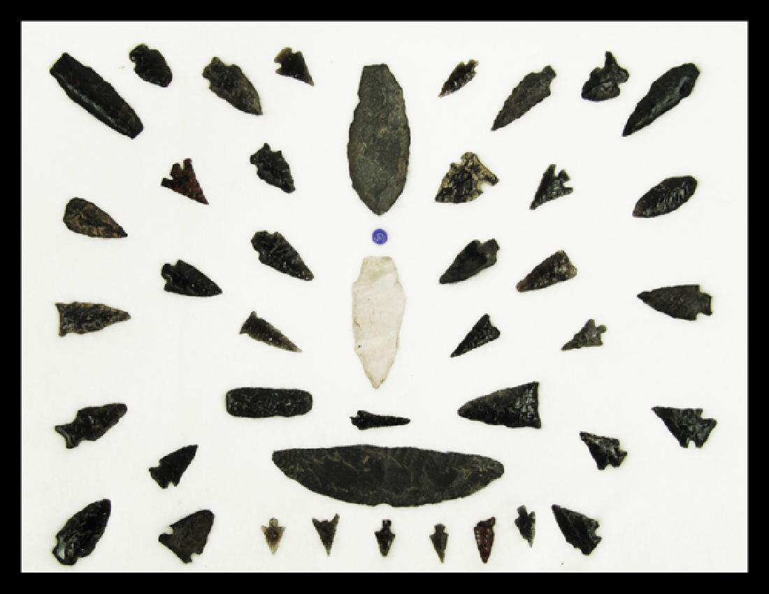 Oregon/California Obsidian Points: Large 17" x 12" ryker mount filled with whole and fragmentary points, blades, and tools, mostly of obsidian. Various conditions. Approximately 43pcs.Largest 4-5/8"Pre Historic