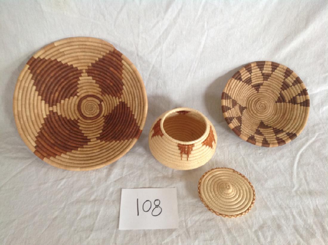 3 Baskets: Group of three decorative baskets from Africa.Largest 12"