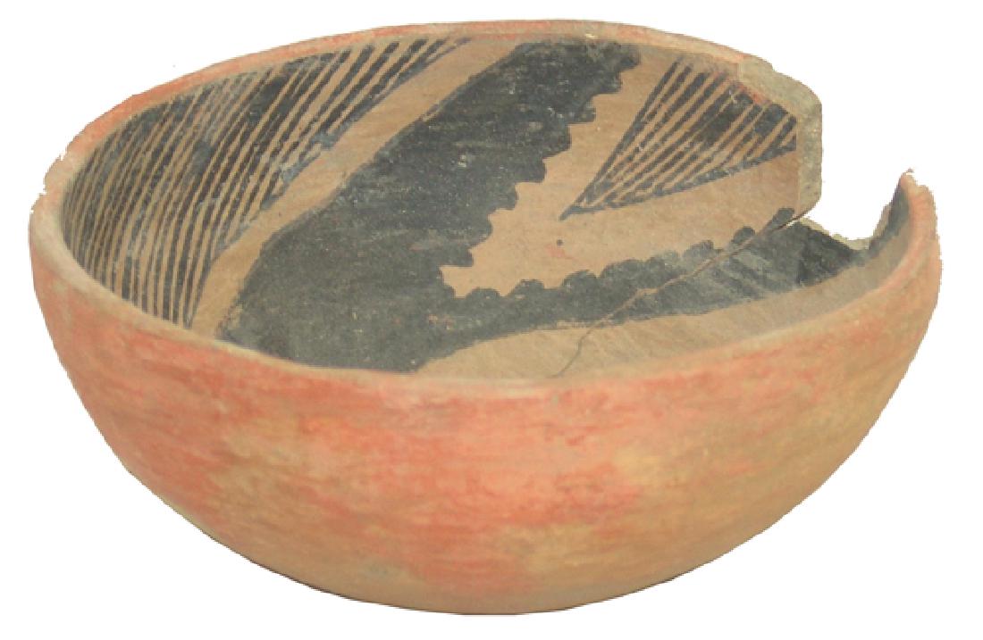 Anasazi Pottery Bowl: Small, black and white-on-red Gila polychrome bowl with hatched interior swirl design. Good condition. Large rim chip and stabilized crack.2-3/4" x 6"Pre Historic