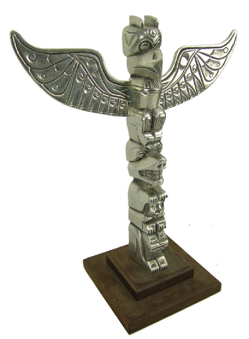 Aluminum Totem Pole: Beautiful and unique cast aluminum four-figure, two-piece, model totem pole with eagle, bear, shaman, one other figure.15" x 12" x 2"Ca. 1980s