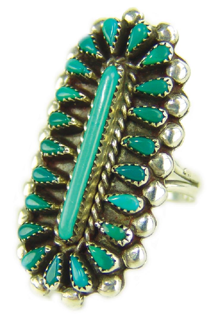 Zuni Ring: Very fine, early, cluster design turquoise and silver ring done in a long oval shape with beautifully aged stones. Very good condition.Mid 1900sSize 9