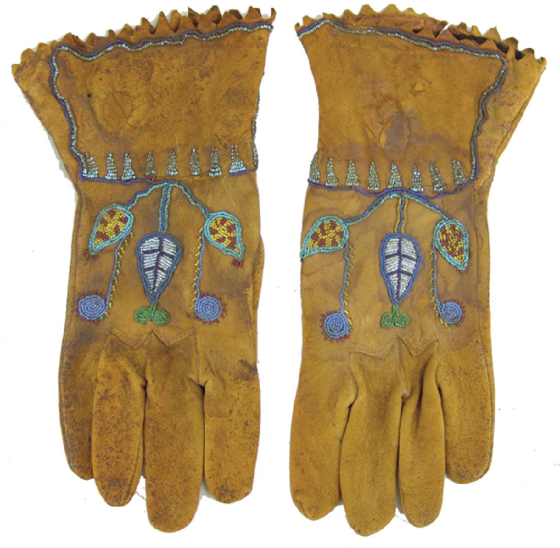 Gloves: Great old pair of short cuff men's buckskin gloves with traditional floral design done with rare 20/0 seed beads, including some cuts. Good condition, shows much use, great patina. Ex. Bob Wills Colle
