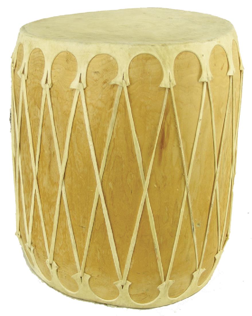 Cochiti Log Drum - Redbird: Classic, Taos style hollowed cottonwood log drum with rawhide faces. Signed "Redbird, Cochiti Pueblo, NM." Very good condition.Ca. 1980s19" x 17"
