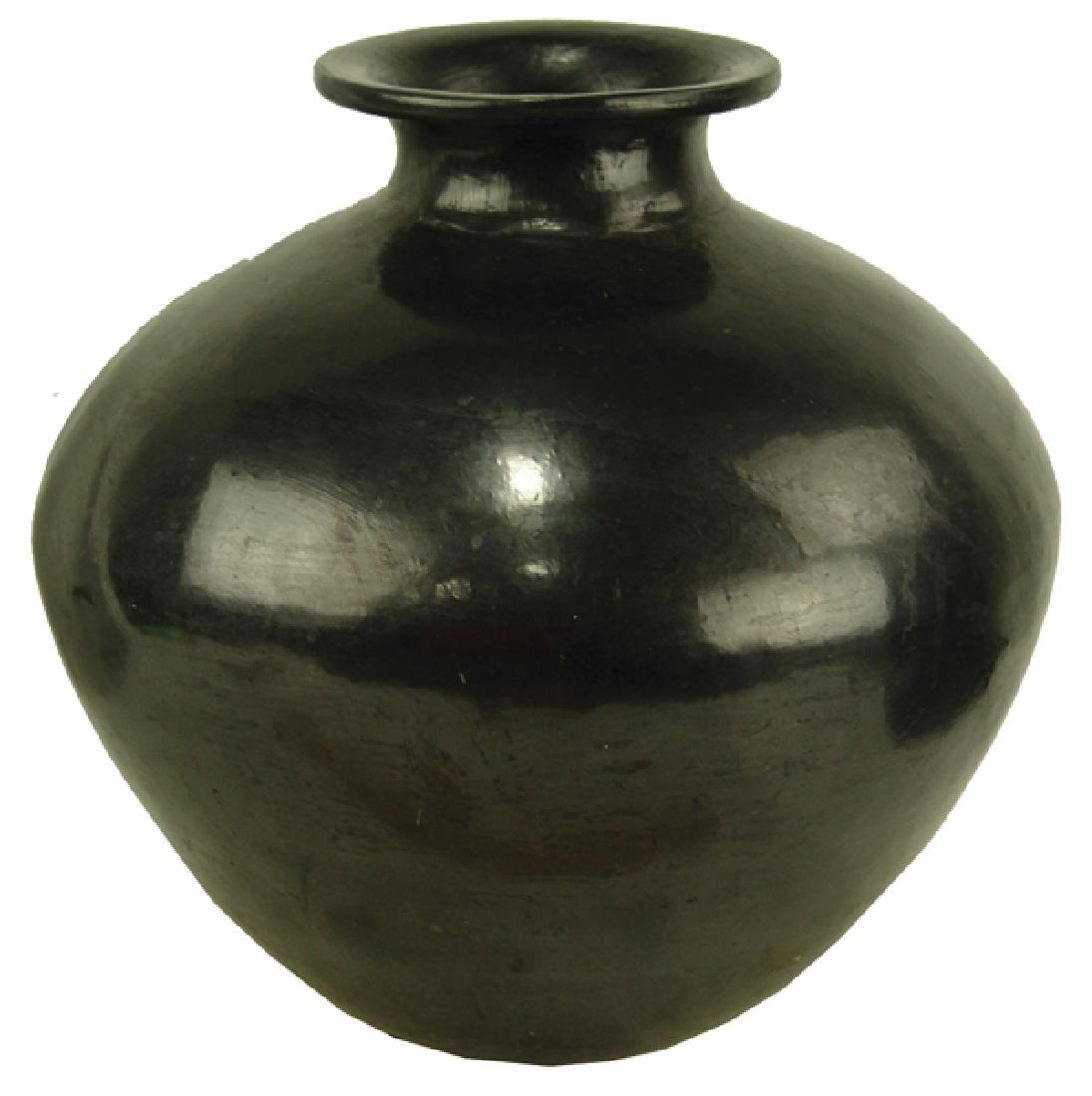 Pueblo Pottery Jar - Dona Rosa: Large and impressive, hand coiled, blackware pottery water/storage jar with beautiful stone polished finish. Done in the old Zapotec way - from Oaxaca.Mid/Late 1900s14" x 13"