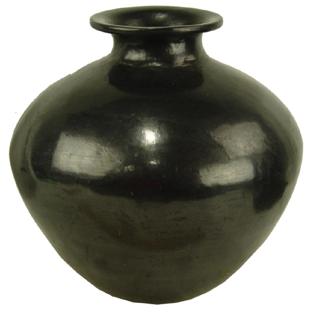 Pueblo Pottery Jar - Dona Rosa: Large and impressive, hand coiled, blackware pottery water/storage jar with beautiful stone polished finish. Done in the old Zapotec way - from Oaxaca.Mid/Late 1900s14" x 13"