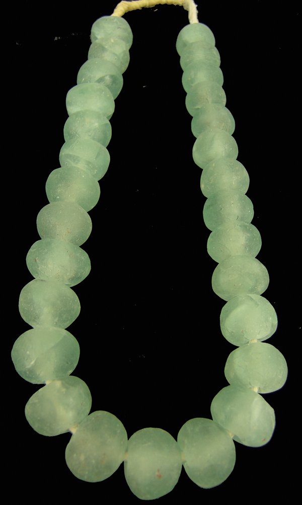 Antique Trade Beads: Single strand of extra large (1-1/2" diameter) ice green Dutch "seaglass" trade beads made from recycled glass. Good condition. A few with chips/cracks.Early/Mid 1900s30"