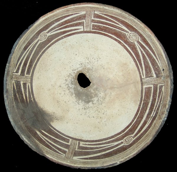Mimbres Pottery Bowl: Killed, black-on-white bowl the 2-1/2" design band with fine line elements, and four negative rectangular sections with interlocking scrolls in the center, and with two drilled holes.Prehistoric4" x 1