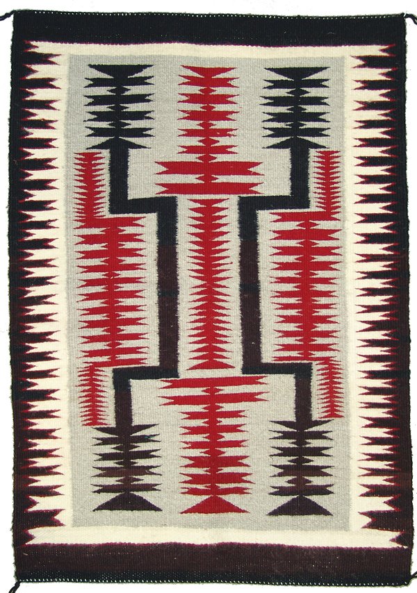 Navajo Rug/Weaving: Classic, fine weave, storm pattern rug with intricate, serrated geometric forms. Very good condition.Ca. 1980s65" x 30"