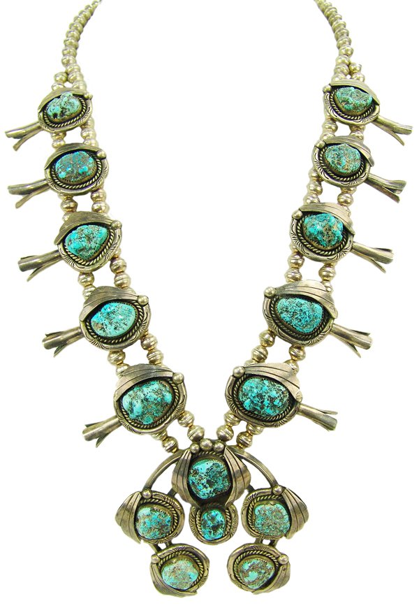 Navajo Necklace - F. James: Ca. 1970s. Impressive, larger sized, all silver squashblossom necklace the 10 side segments and 6 naja stones all of matching, high-grade, Seafoam turquoise nuggets. Very good condition, nice patina. 