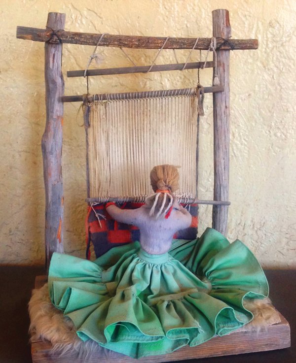 Navajo Weaver Loom: Traditional, handwrought doll with loom and small Navajo rug. Good condition. 18" x 13" Ca. 1980s