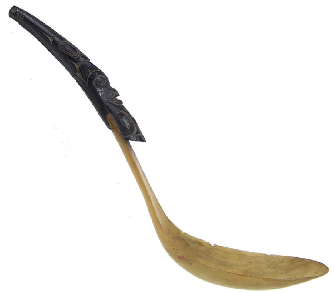 Tlingit Carved Horn Spoon: Very fine, two-piece, hand-carved goat horn spoon with totemic, dark horn handle containing several stylized figures. Very good condition, some chips on bowl edge.Mid 1900s13"
