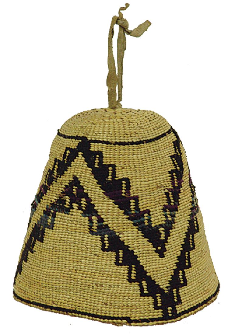 Nez Perce Corn Husk Hat: Traditional, finely woven conical "Fez" with repeating geometric design done with woolen yarns, some of which have naturally discolored in an interesting way. Very good condition, unlined.Early/Mid 19