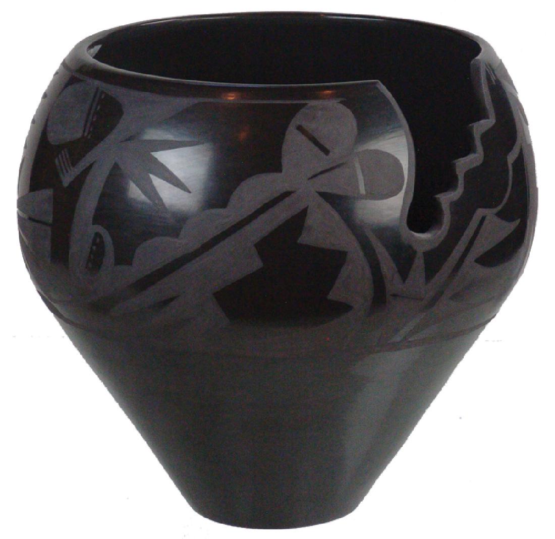 Carmelita Dunlap Pottery Jar (1925-2000): Wonderful, rather large, San Ildefonso black-on-black pottery jar with stepped cut out and unique floral and zoomorphic forms. With "Best of Class" ribbon form the 1982 Gallup Ceremonial. Very good co