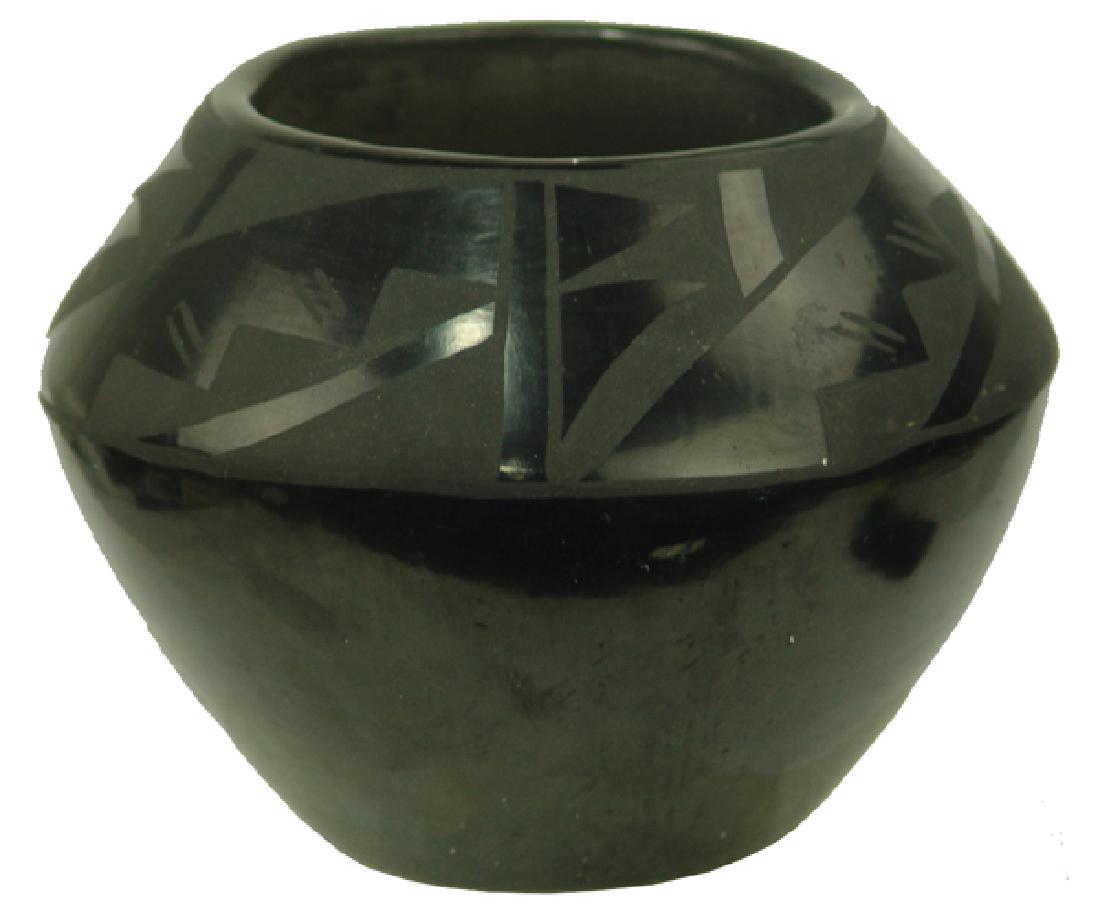 San Ildefonso Pottery Jar - Marie Anita Martinez: Very rare, matte black-on-black jar with traditional geometric motif. Very good condition. Maria Anita is the daughter of Santana and Adam, and Maria's granddaughter.Mid 1900s5" x 6-1/2"