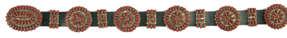 Zuni Concho Belt - Paul Jones: Finer, coral and silver ladies concho belt with nine, cluster design, 1-3/4" round rosette conchos, ten spacers, and larger, oval buckle. Containing 446, individually hand cut and set stones. Very goo