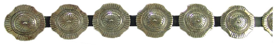 Navajo Concho Belt - Robert Johnson: Original design, all silver concho belt with matching stamped details on the ten, unique shaped 2-1/8" x 2-1/8" conchos and buckle. Very good condition.Ca. 1980s30-38"