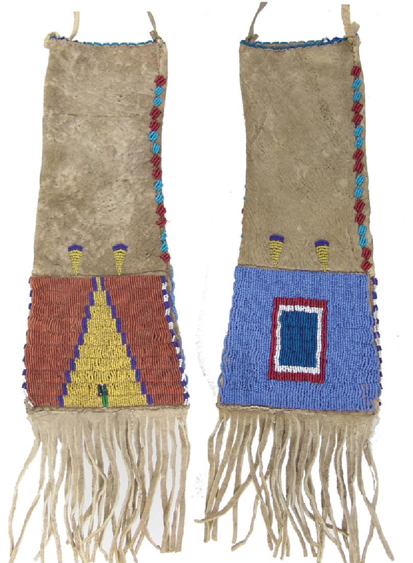 Blackfeet Beaded Pipe Bag: Small, traditional, two-sided buckskin pipe/tobacco bag with flared body, lazy stitch beaded panel and trim, and long fringe. Very good condition, a few missing beads.Ca. 1950s-1960s13"