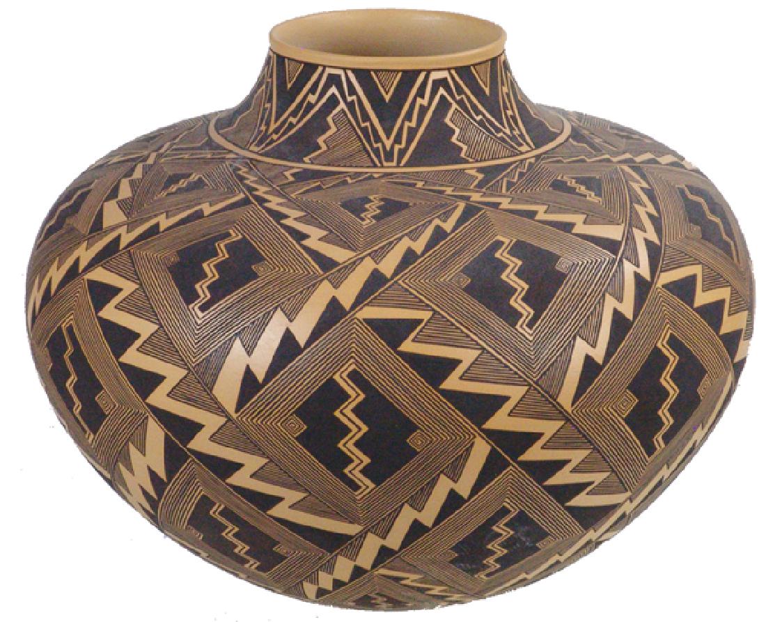 Anasazi Style Pottery Jar: Huge and beautiful black-on-buff, thin walled water jar with bold geometric designs including hatching, scrolls, and lighting symbols. Excellent condition, singed "Bletbo"(?)Late 1900s14" x 17"
