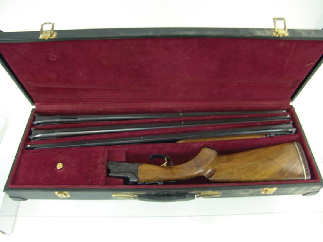 Ithaca / SKB Triple Shotgun: Beautiful, Model 600 shotgun with interchangeable 20 ,28, and 410 gauge barrels, all with dual bead sights, vent ribs, and ejectors and all sharing a checkered forearm. Very good condition, inMid/Late