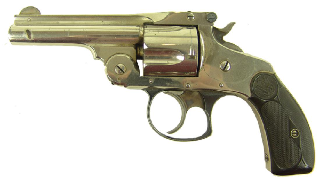 Smith and Wesson .38 Fourth Model Revolver: Nickel plated .38 caliber double action revolver with five-shot fluted cylinder, hard rubber grips, top break action, and S&W logo on grips and case. Good condition. SN 347786.Ca. 1890s3-1/4"