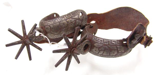 Antique Mexican Spurs: Early 1900s Standard Rare old pair of double mounted with overlaid, Mexican silver designs, and with 3", eight-point rowels. Good condition