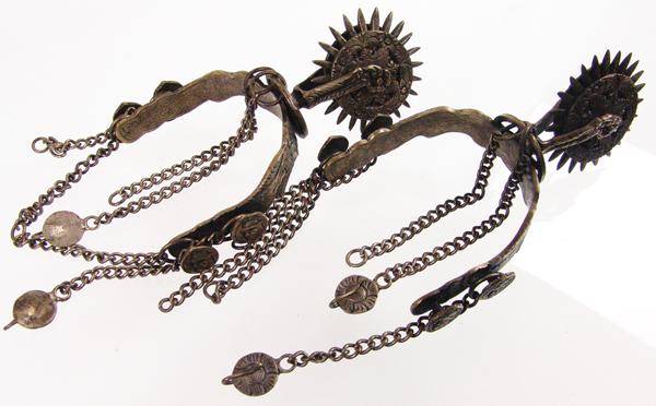 Antique Argentine Gaucho Spurs: Early 1900s Standard Ornately engraved, fancy cowboy spurs with double portrait buttons for leathers/chains, the 3", 24-point rowels sandwiched between engraved discs. Also engraved on the