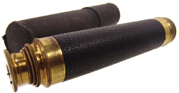 Tower Antique Telescope: Early - mid 1900s 23" Three-pull, brass and leather antique spyglass marked "20-36 6306". Good condition, with case.