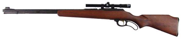 Marlin Model 57 Refle: Mid/Late 1900s 42-1/2" Lever action, .22 magnum cal. rifle with 24" blued barrel, plain, one piece, walnut stock, and Tasco 4x15 scope, pitted trigger. Very good condition.