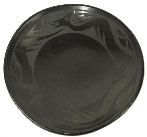 Marie and Santana Pottery Plate: Mid 1900s 1-1/2" x 9"Classic, San Ildefonso black-on-black pottery plate with traditional Avanyu design band, done by Maria Martinez and her daughter-in-law, Santana. Very good condition. Minor surfac