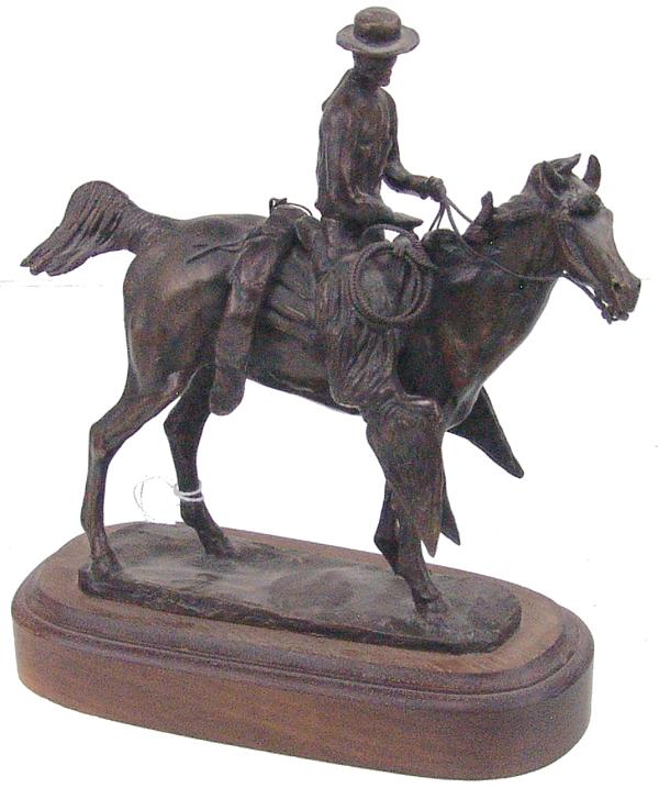 Earl Heikka, MT/AZ (1910-1941): Early 1900s 7" x 7-1/2 x 3" Famous, limited edition (#14/299) Western bronze sculpture titled "Rider on Horse" Very good condition.