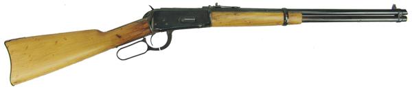 Winchester 1894 Carbine: Mid 1900s 38" Famous model 1894 lever action carbine with 20" round barrel, single barrel ring, and refinished/repaired stock. Good condition, in .25-35 caliber. S/N 660965.