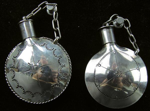 2 Navajo Silver Canteens: Ca. 1980s Largest 3" x 2" Pair of beautiful, handwrought, all silver canteens with hand stamped designs, removable caps, and silver chains, one with rope work edging. Very good condition, unsigned.