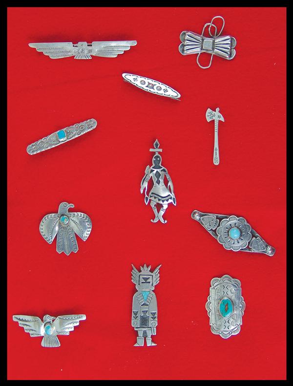 Navajo Pin Display: Mid/Late 1900s Largest 3" Wonderful group of 11, stamped, cast, overlay, and handwrought silver blouse/kilt pins, all in Indian themes. Very good condition, in 11" x 8" glass display.