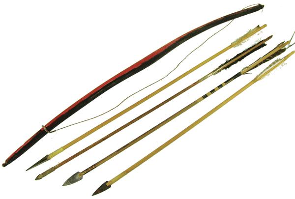 Apache Child's Bow & 4 Arrows: Traditional, hand carved and painted short bow with sinew string, plus four, different style arrows, each with some fletching and with steel tips. Good condition. Mid 1900s. 33".