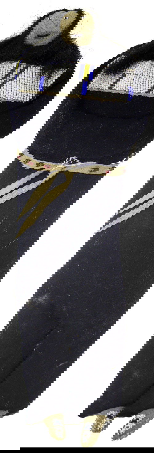 Crow Doll: Unique, old-style, stuffed buckskin and tradecloth doll with moccasins, belt, beaded yoke, and human hair. 16" Late 1900's