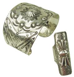 Navajo Silver Bracelet and Ring - Fred Peshlakai: Fine, handwrought, wide cuff bracelet. Elaborate stamped top containing manly Fred Harvey style figures, including repousse elements. Includes matching, size 10 ring. Very good condition. Ca. 1980s. 6