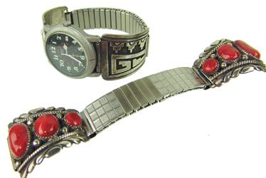 Two Navajo Watchbands - T. Singer & R. Leekity: Pair of classic, all silver watch tips including one Hopi overlay style by Tommy Singer, and a carved coral pair by Robert Leekity. Both in very good condition with good patina. On flex bands. Ca. 197